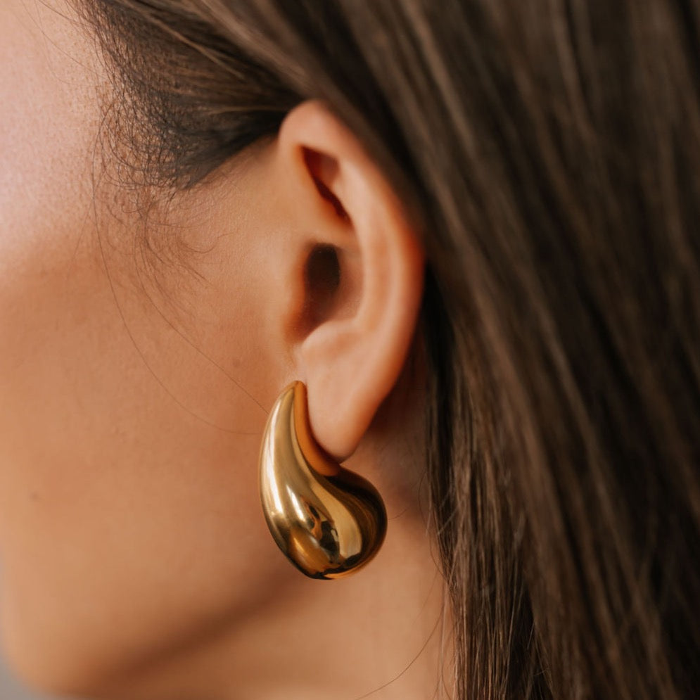 Hailey Bieber big gold earrings