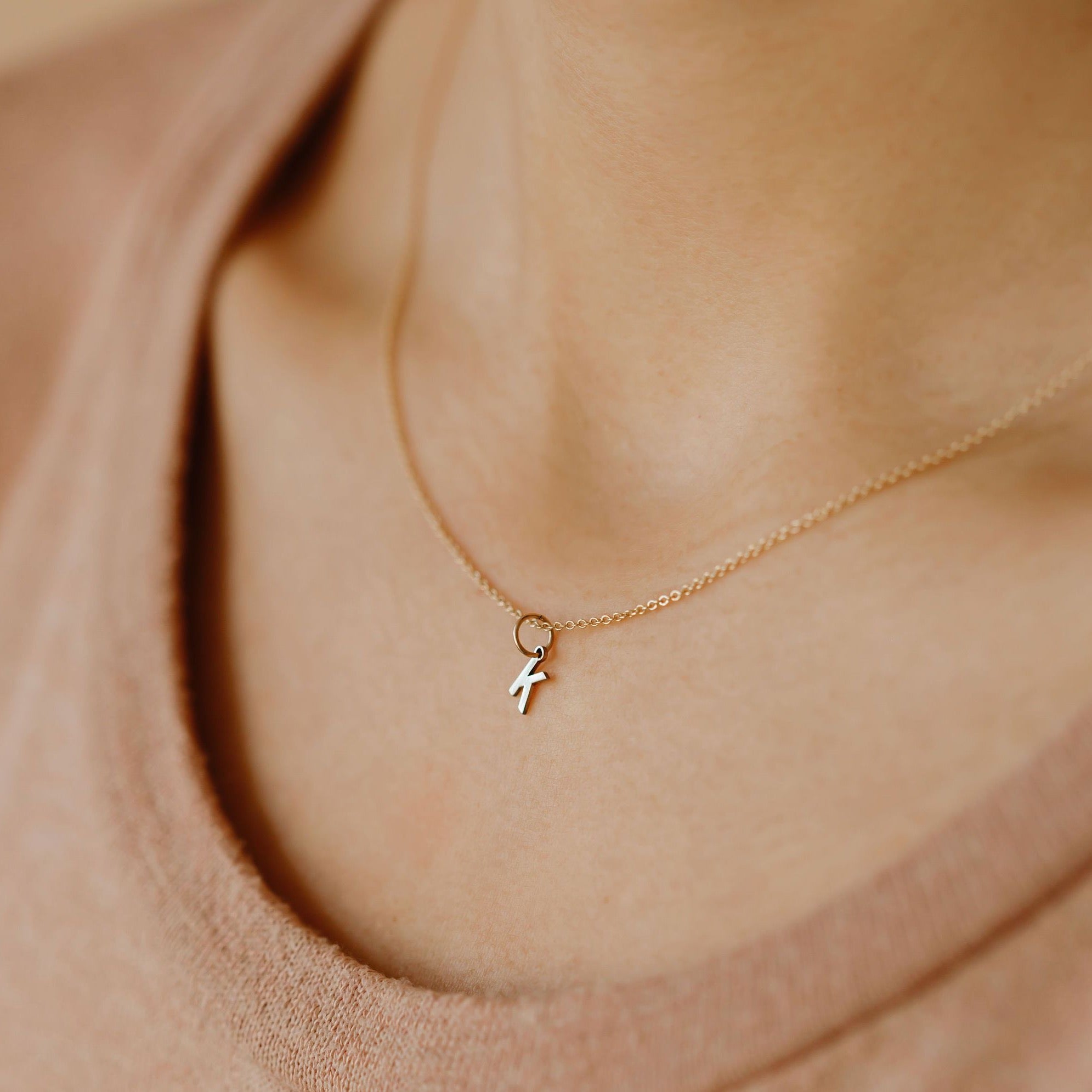 Initial pendant necklace with letter K in Arial basic font