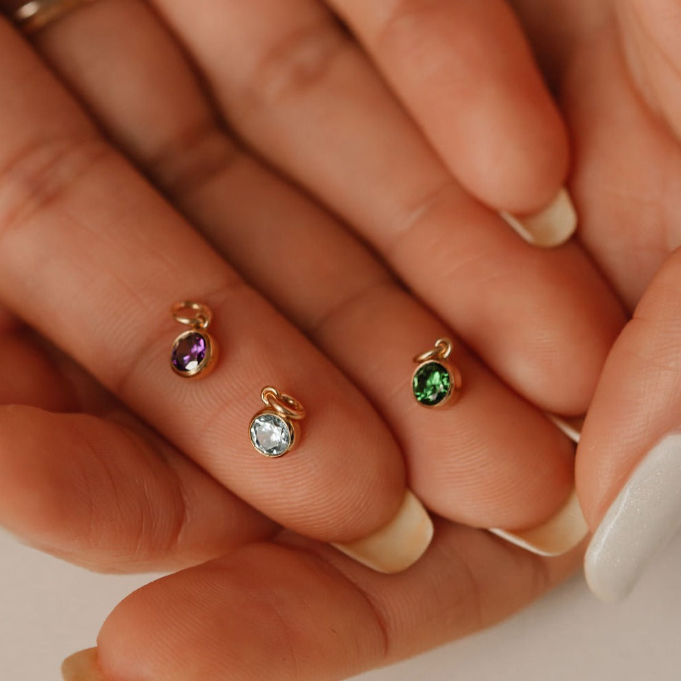 birthstone charms on the palm