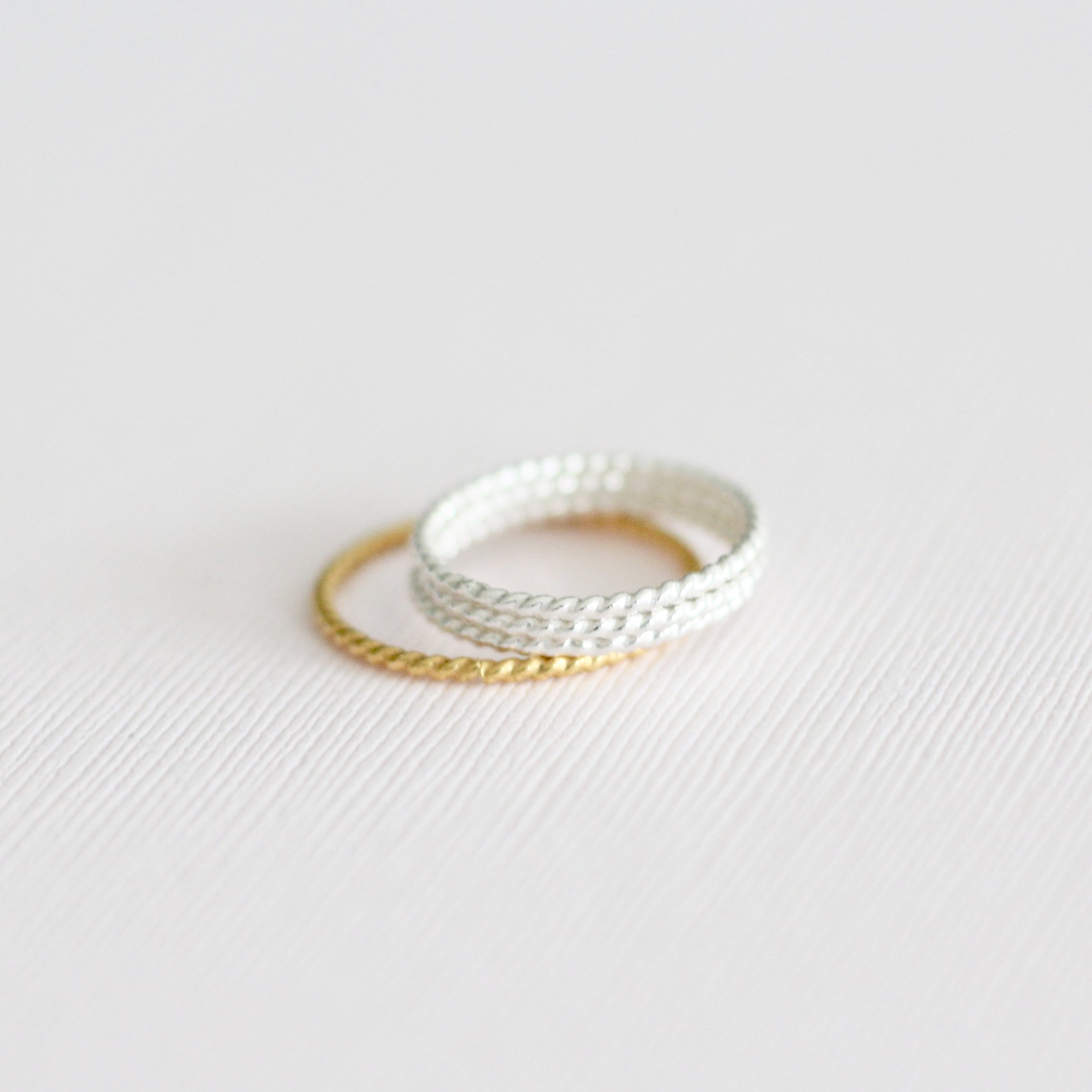 gold and sterling silver twisted stackable rings